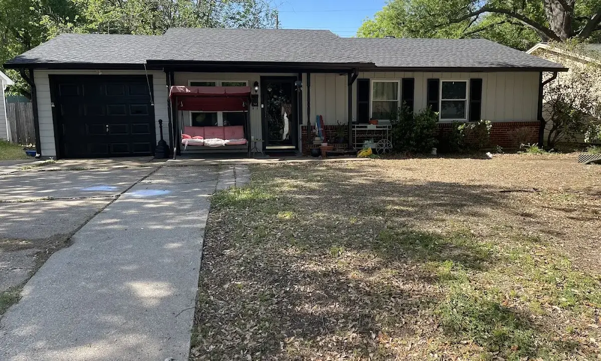 Asphalt Shingle Roof Repair crew at work on a residential roof in Laurinburg